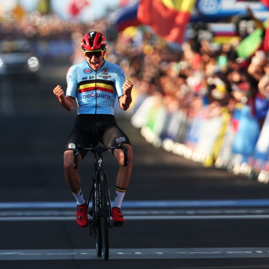 Remco Evenepoel crossing the finish line to win his medal
